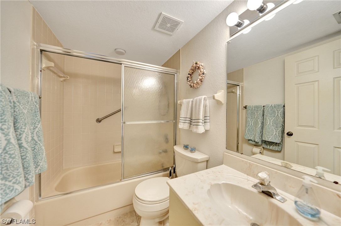 220 Coldeway Drive, Unit 112 Punta Gorda, FL 33950 - Photo 26 of 50 a bathroom with a sink toilet tub and shower