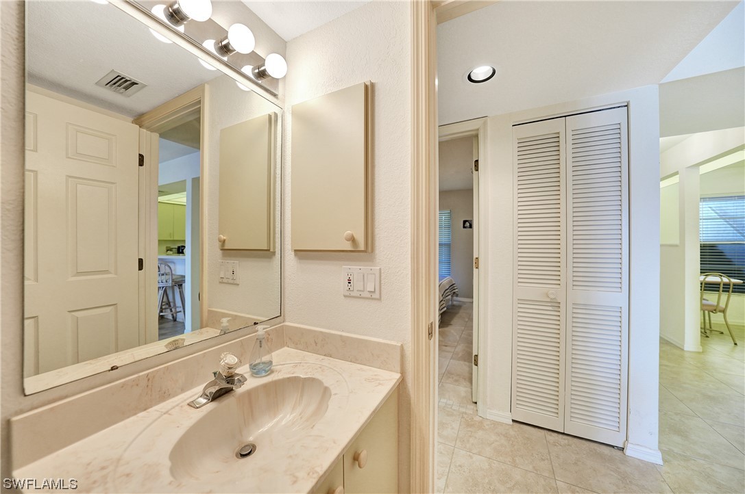 220 Coldeway Drive, Unit 112 Punta Gorda, FL 33950 - Photo 27 of 50 a bathroom with a sink shower and a mirror