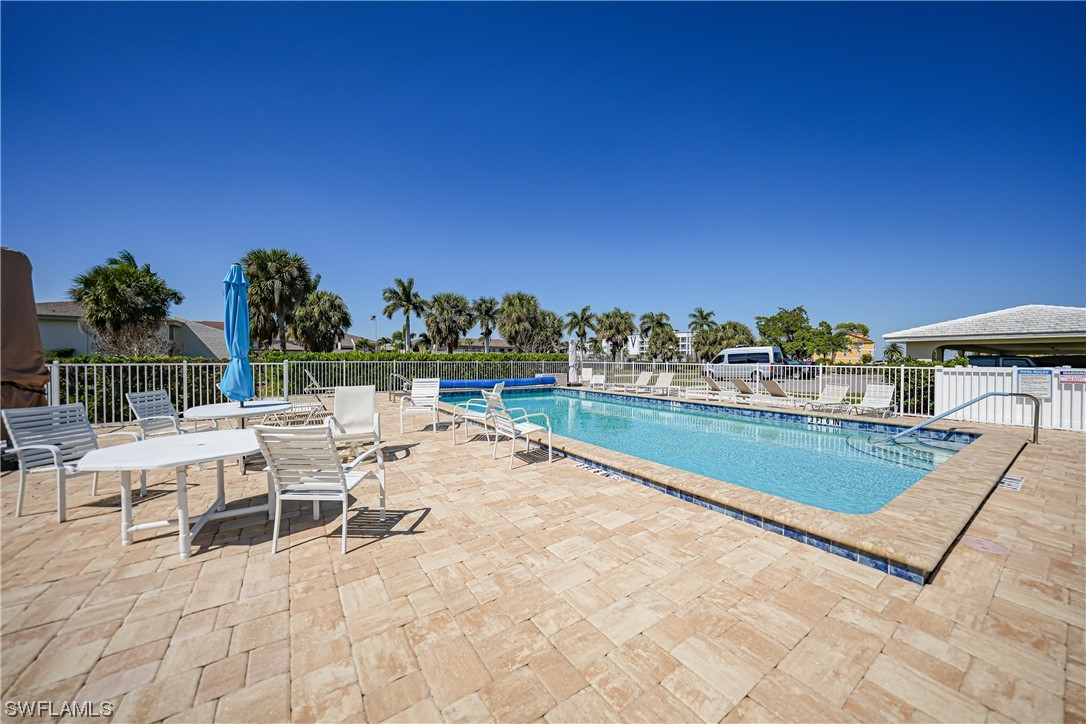 220 Coldeway Drive, Unit 112 Punta Gorda, FL 33950 - Photo 34 of 50 a view of a chairs and table on the terrace