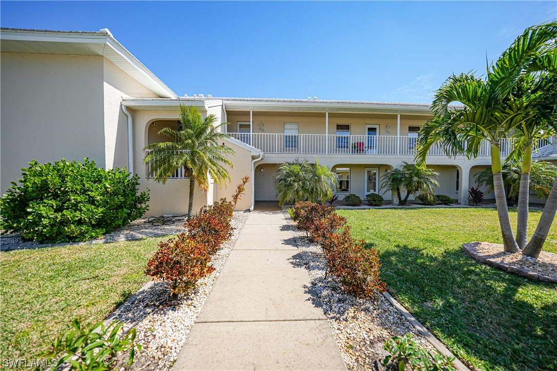 220 Coldeway Drive, Unit 112 Punta Gorda, FL 33950 - Photo 39 of 50 a front view of a house with garden