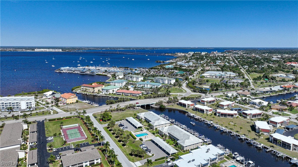 220 Coldeway Drive, Unit 112 Punta Gorda, FL 33950 - Photo 47 of 50 an aerial view of a city with lots of residential buildings ocean and mountain view in back