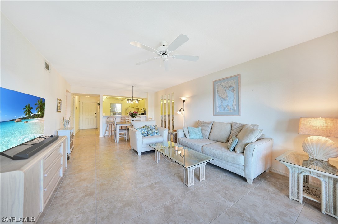 220 Coldeway Drive, Unit 112 Punta Gorda, FL 33950 - Photo 10 of 50 a living room with furniture and a flat screen tv