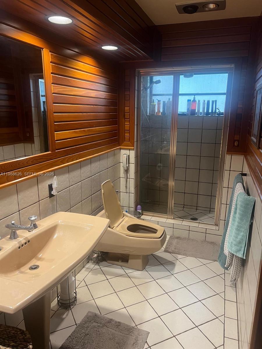 30705 Southwest 197th Avenue Homestead, FL 33030 - Photo 11 of 17 a bathroom with a sink a toilet and shower