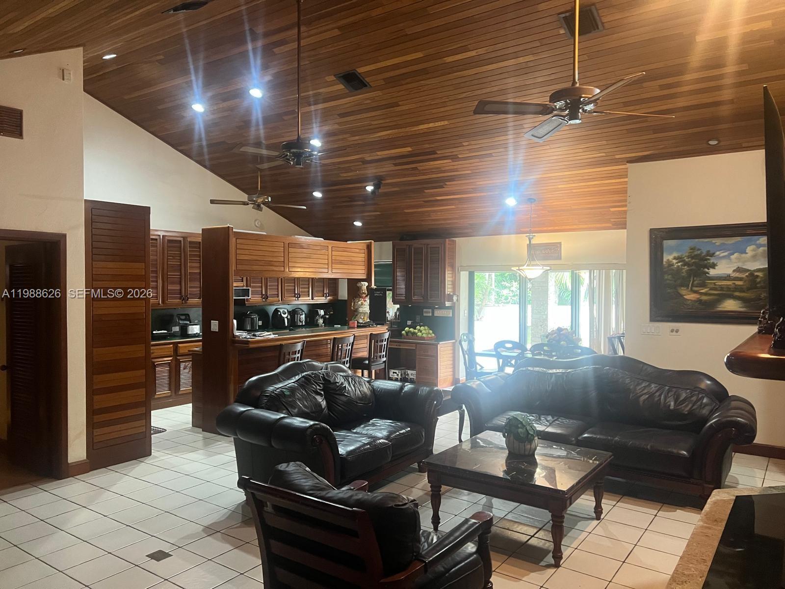30705 Southwest 197th Avenue Homestead, FL 33030 - Photo 5 of 17 a living room with furniture and a large window