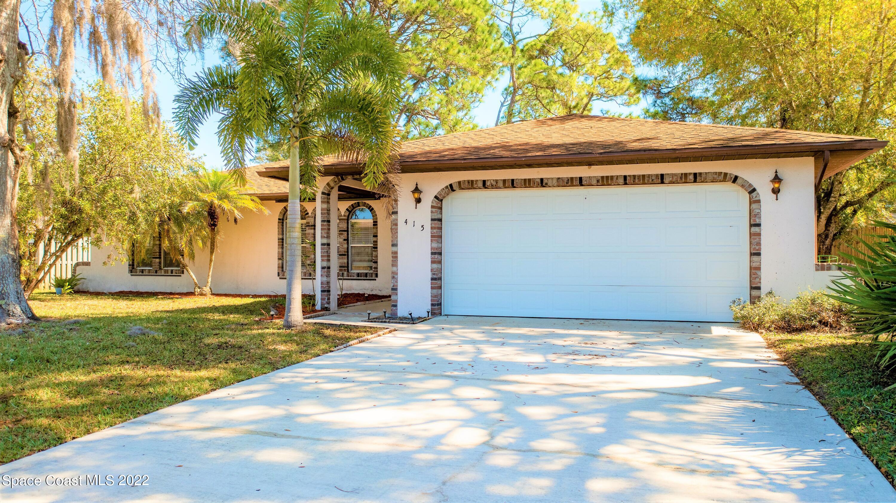 415 Cortez Road Palm Bay, FL 32907 - Photo 1 of 22 a view of a house with basketball court