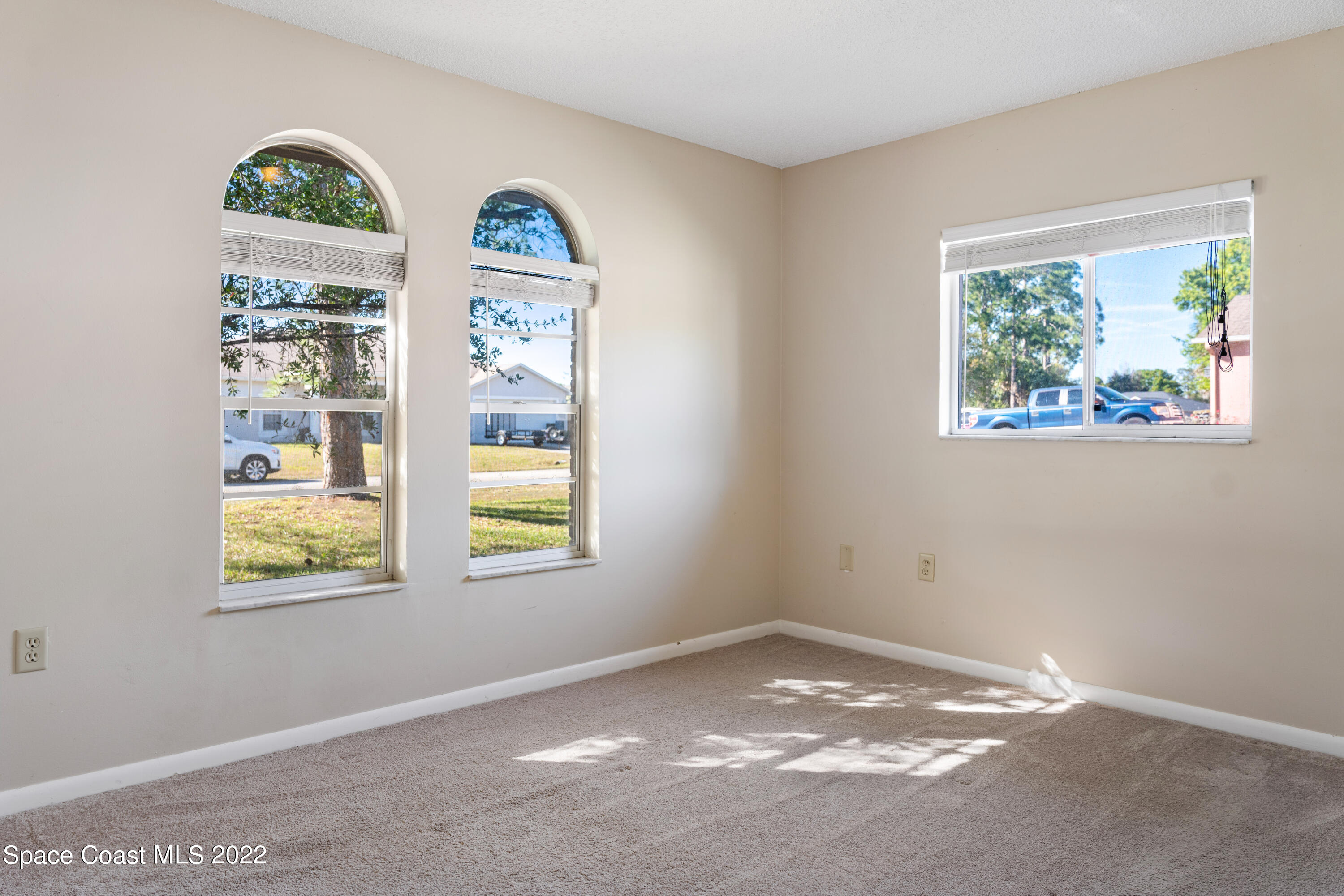 415 Cortez Road Palm Bay, FL 32907 - Photo 11 of 22 a view of room with window and painting on the wall