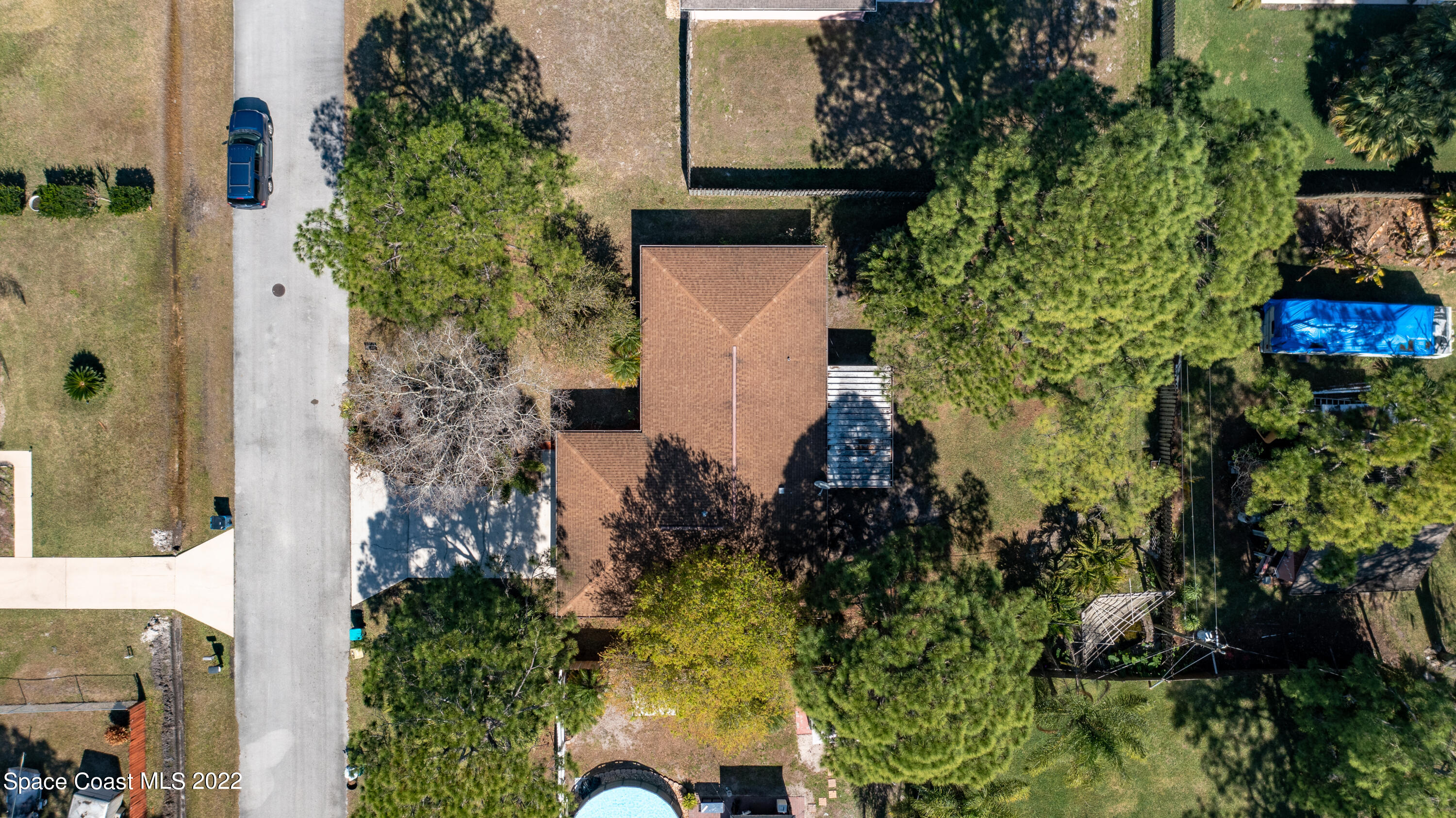 415 Cortez Road Palm Bay, FL 32907 - Photo 6 of 22 an aerial view of a house with a yard and garden