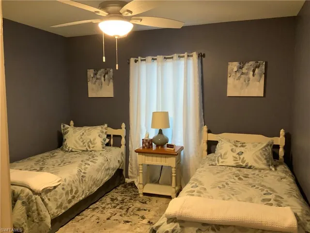 a dining room with furniture and chandelier