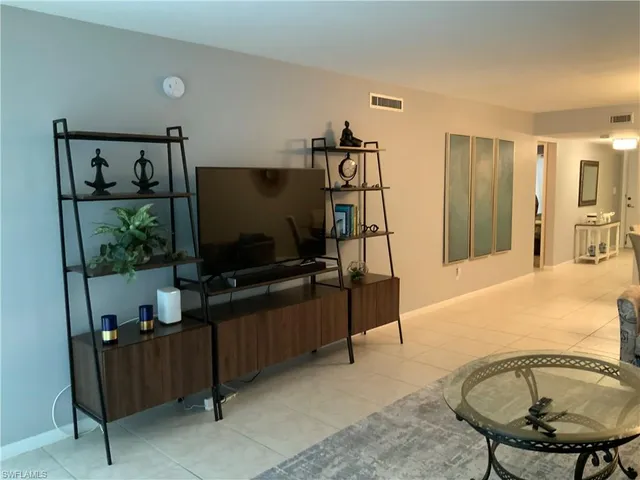 a bathroom with a sink a mirror and shower