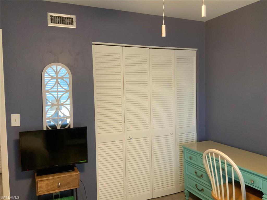 5530 Rattlesnake Hammock Road, Unit K103 Naples, FL 34112 - Photo 7 of 32 a view of a livingroom with a window