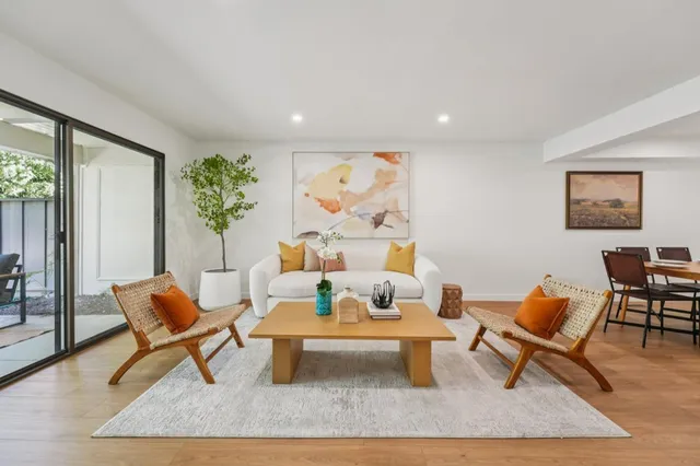 a living room with furniture and a table