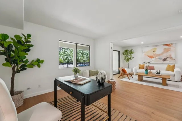 a bathroom with a sink vanity mirror and toilet