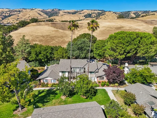an aerial view of a house with a garden