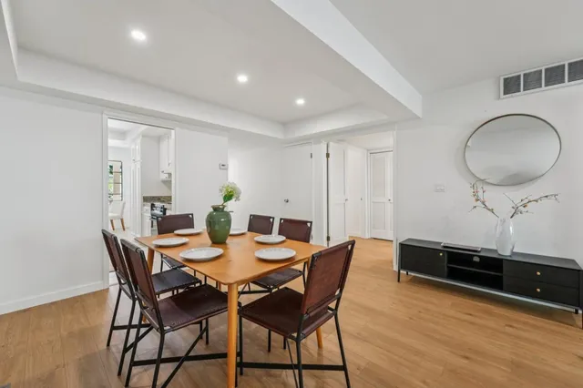 a view of a dining room with furniture and window