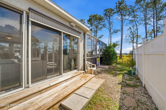 a view of backyard with patio