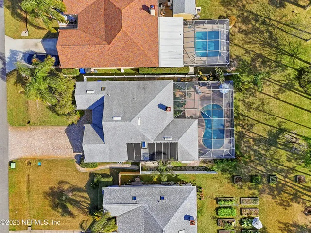 aerial view of a house with a swimming pool
