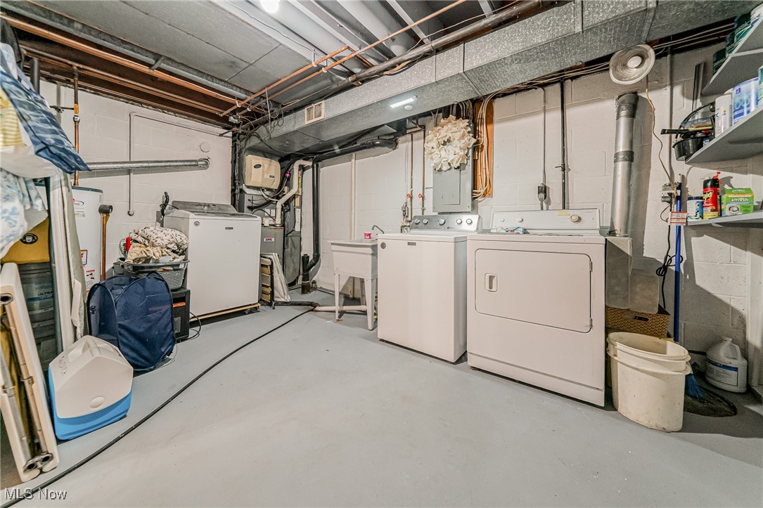 595 Moorfield Road Fairlawn, OH 44313 - Photo 43 of 50 Laundry room with washer and clothes dryer and gas water heater