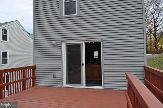 a view of a brick house with a large window