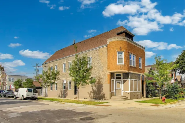 a front view of a building with a street view