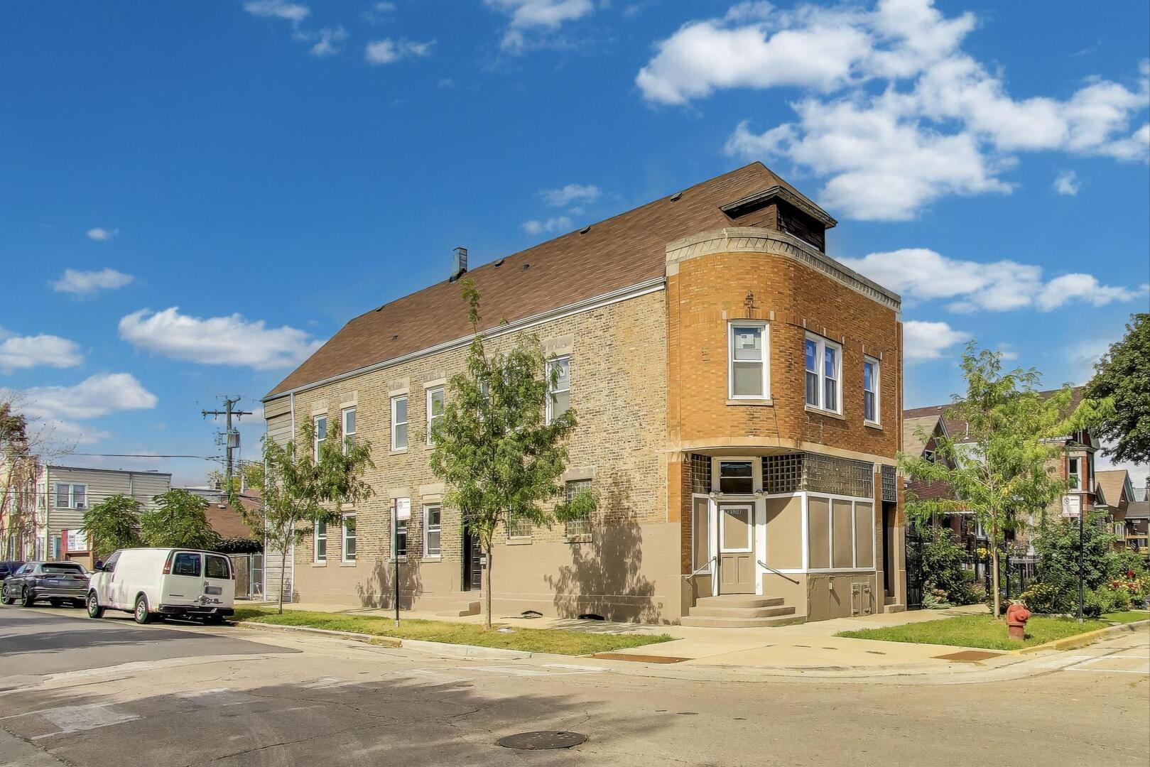 a front view of a building with a street view