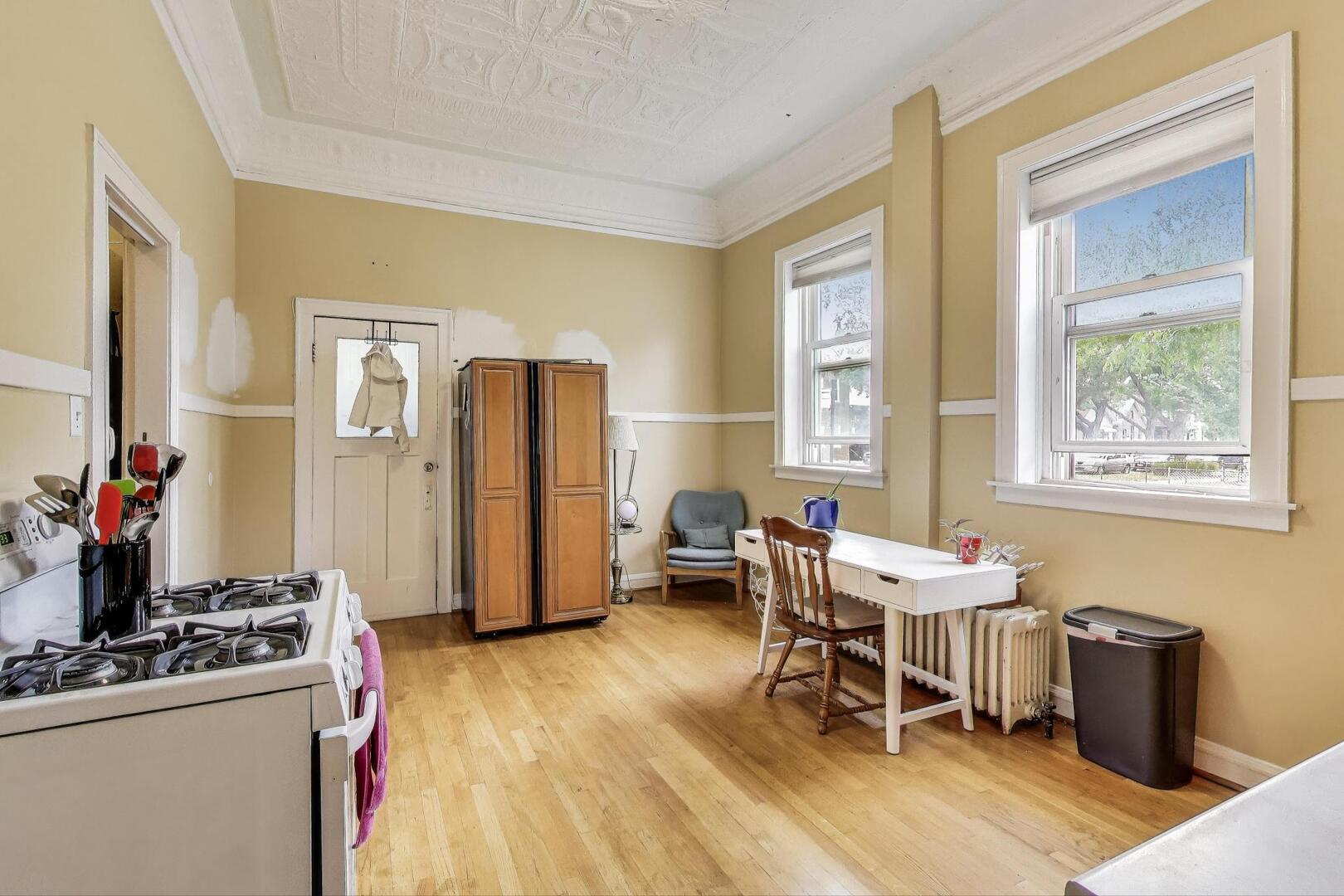3558 South Honore Street Chicago, IL 60609 - Photo 12 of 37 a dining room with furniture and a window