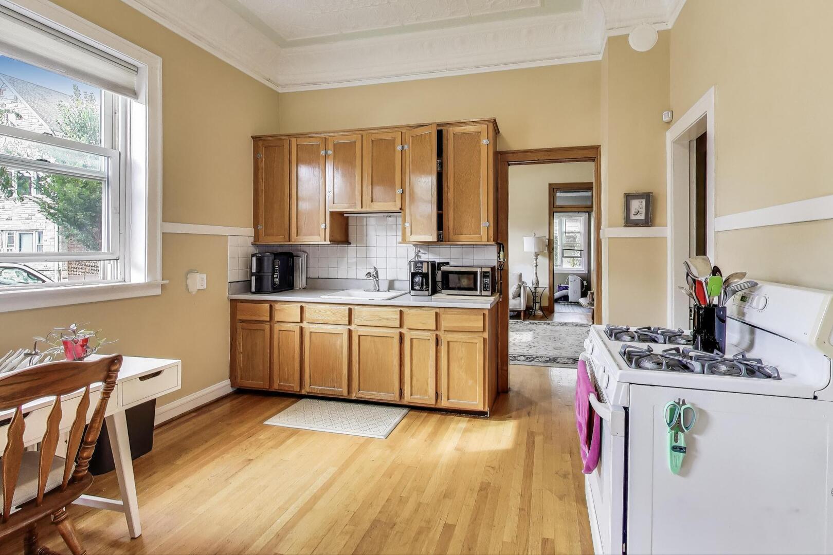 3558 South Honore Street Chicago, IL 60609 - Photo 15 of 37 a kitchen with a sink cabinets and window