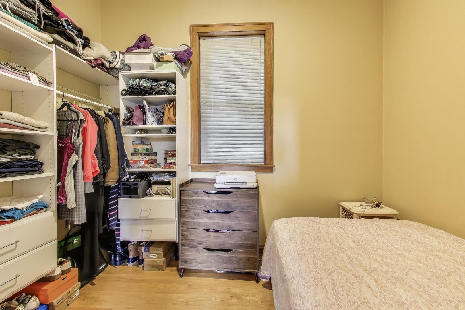 3558 South Honore Street Chicago, IL 60609 - Photo 16 of 37 a bed room with a bed and a closet