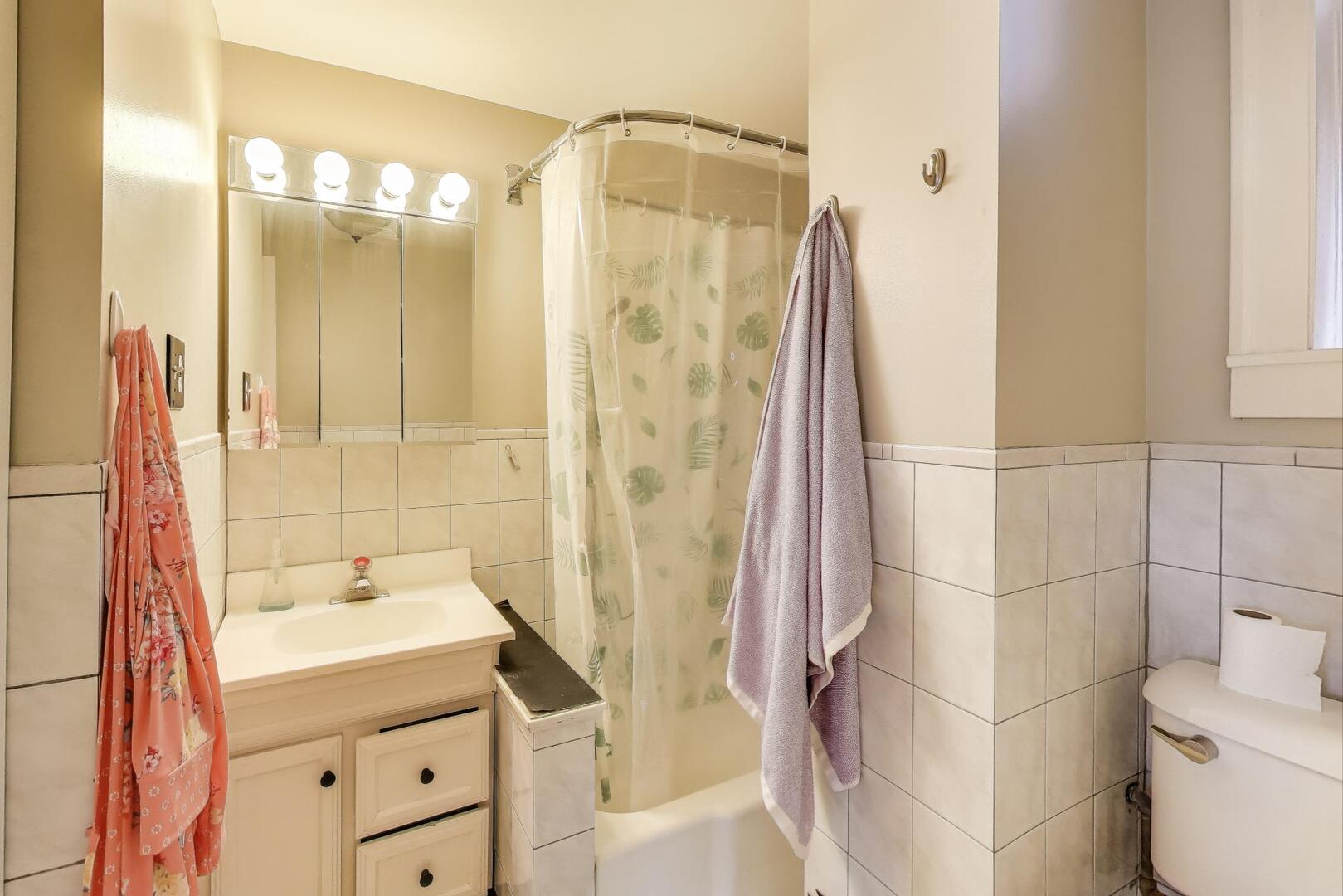 3558 South Honore Street Chicago, IL 60609 - Photo 18 of 37 a bathroom with a sink and a mirror