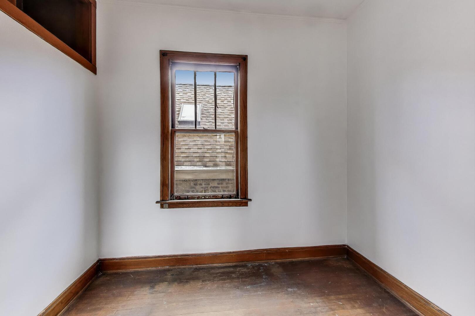 3558 South Honore Street Chicago, IL 60609 - Photo 20 of 37 a view of a room with wooden floor and windows