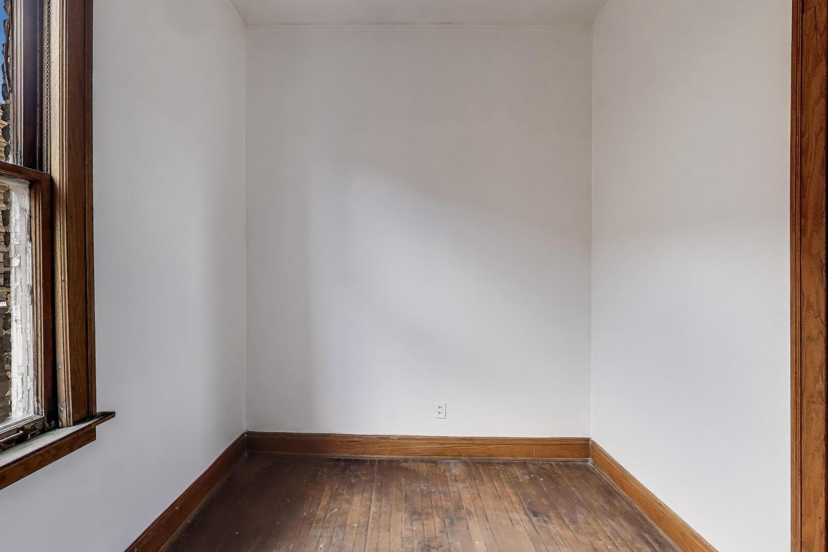 3558 South Honore Street Chicago, IL 60609 - Photo 21 of 37 a view of a small space with wooden floor and a window