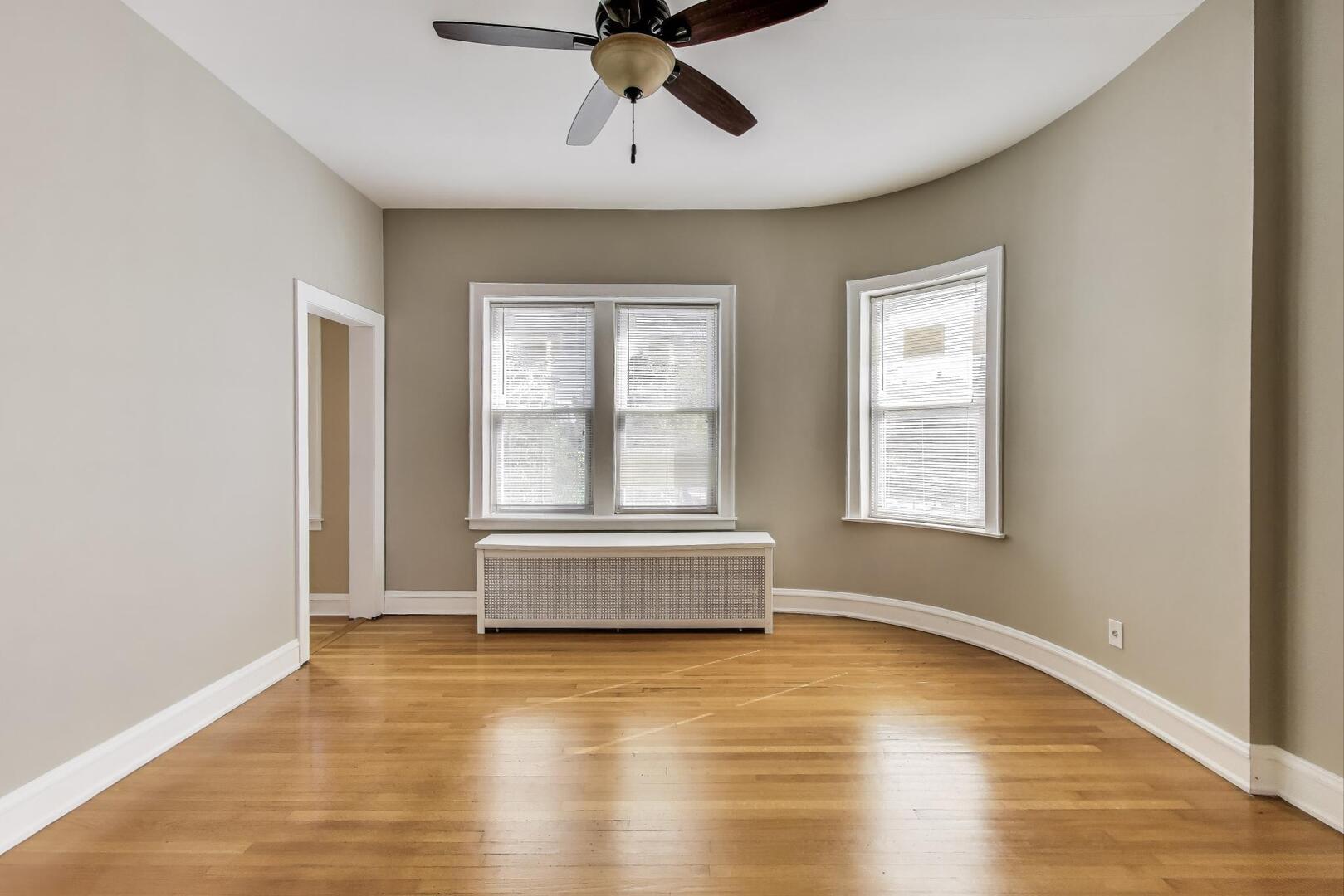 3558 South Honore Street Chicago, IL 60609 - Photo 26 of 37 an empty room with a window and ceiling fan