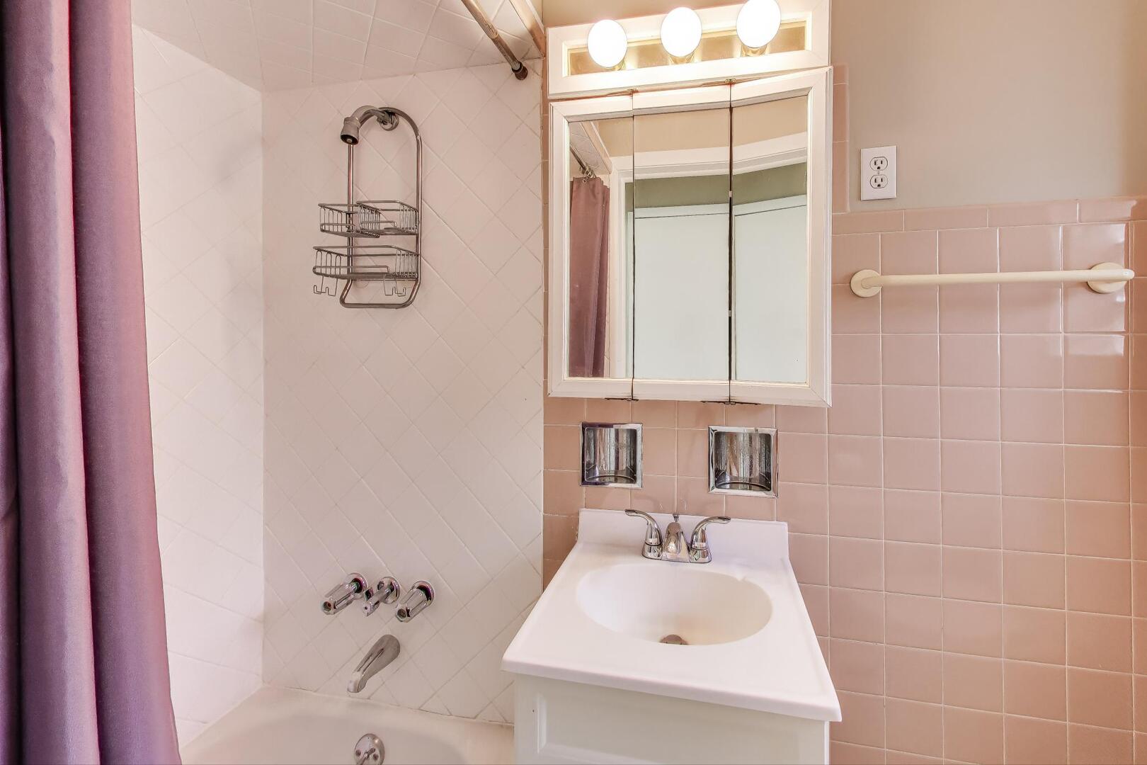 3558 South Honore Street Chicago, IL 60609 - Photo 34 of 37 a bathroom with a sink a toilet and a mirror