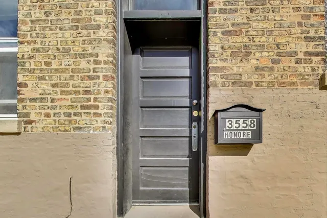 a white toilet sitting next to a shower curtain