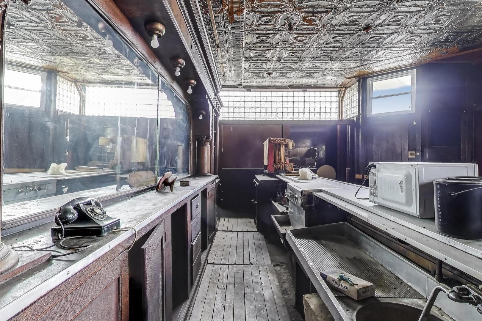 3558 South Honore Street Chicago, IL 60609 - Photo 6 of 37 a kitchen with sink stove and cabinets