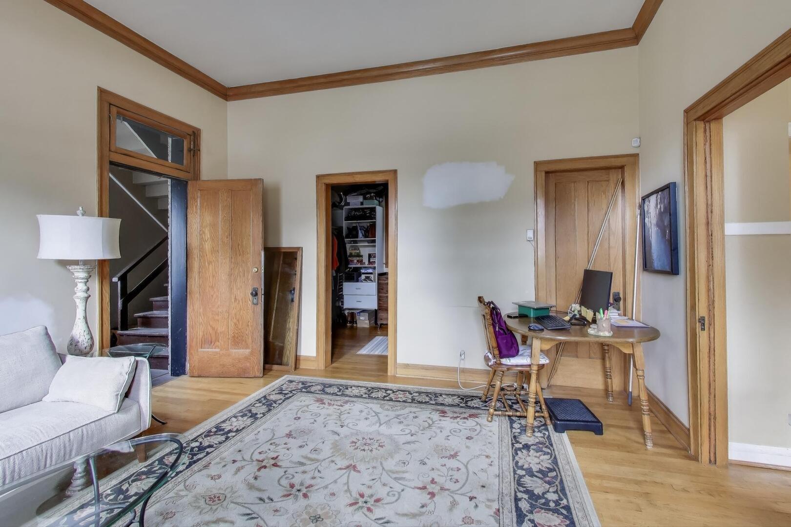 3558 South Honore Street Chicago, IL 60609 - Photo 10 of 37 a bed room with a bed and a chair