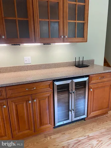 a kitchen with stainless steel appliances granite countertop wooden cabinets a sink and dishwasher