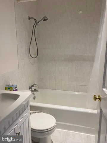 a bathroom with a sink a toilet and a bathtub