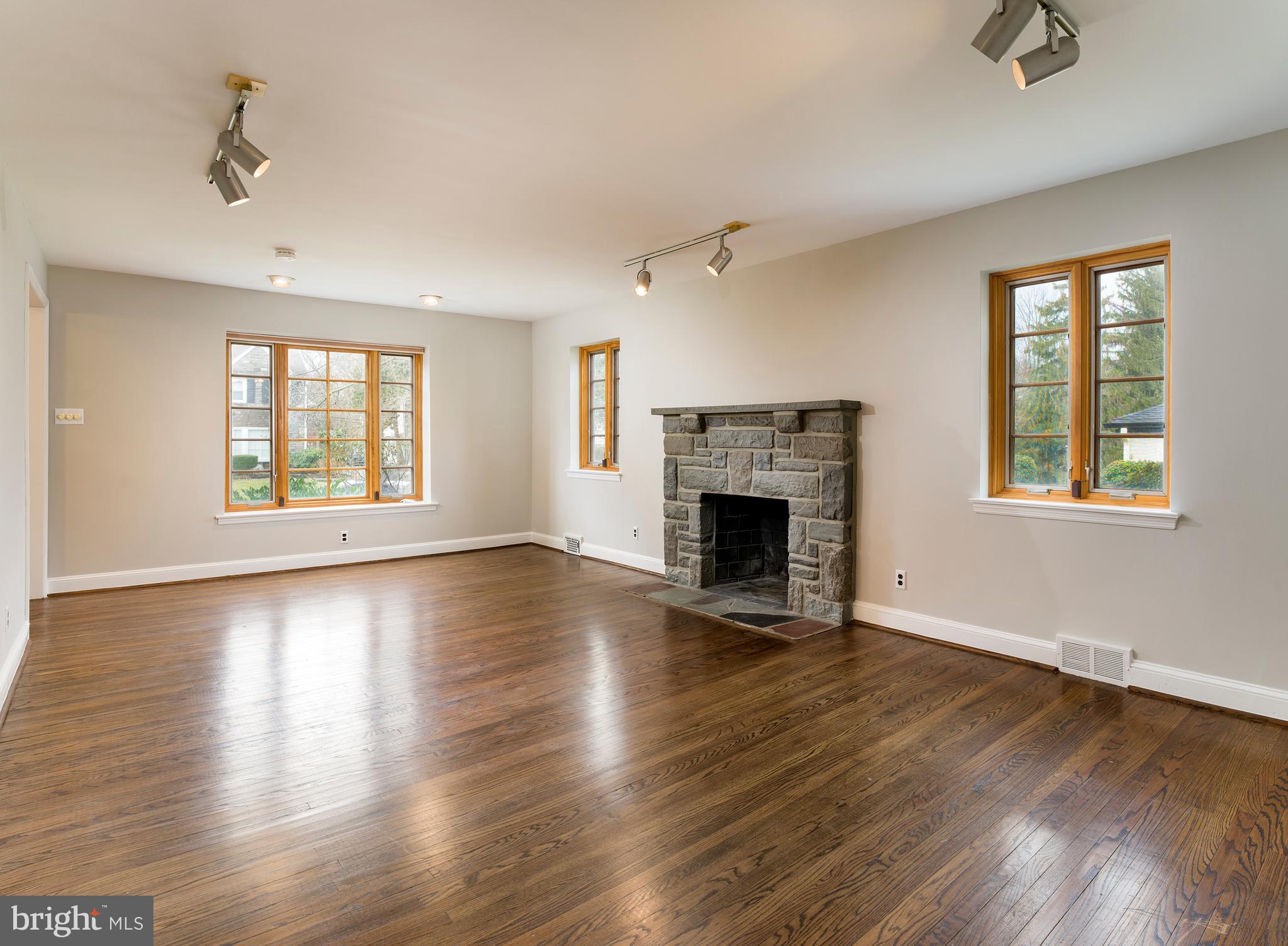 627 Greythorne Road Wynnewood, PA 19096 - Photo 3 of 16 Living Room with Wood Burning Fireplace