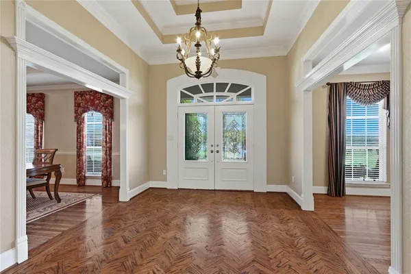 a view of a workspace with furniture and wooden floor