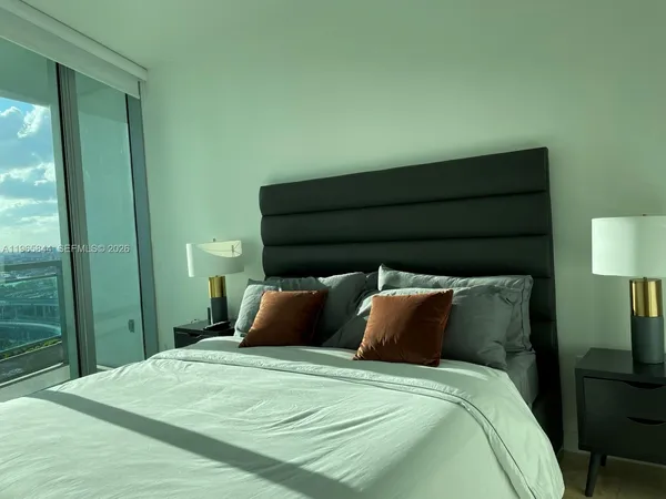 a bathroom with a sink a toilet and shower curtain