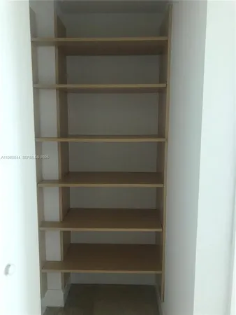 a view of a balcony with a book shelf