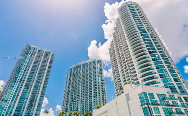 a view of a large building with a yard