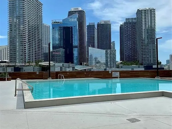 a view of lobby with lamp and stairs