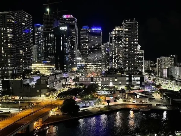 a kitchen with stainless steel appliances granite countertop a sink and a stove