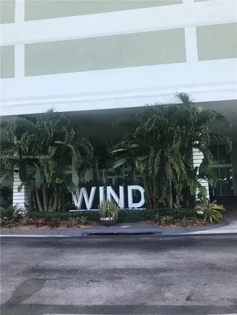 a kitchen with stainless steel appliances granite countertop a sink a stove a microwave and cabinets