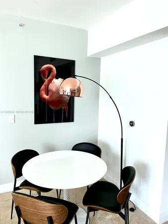 a bedroom with a bed and a mirror