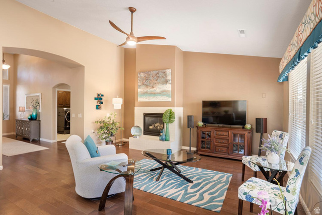 1587 Whitestone Drive St. George, UT 84790 - Photo 7 of 36 Spacious living area featuring wood-finish flooring, vaulted ceilings, and a corner fireplace