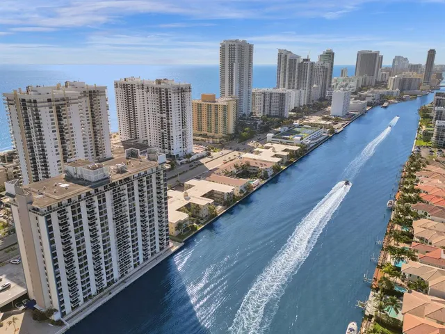 a view of city from balcony with city and ocean