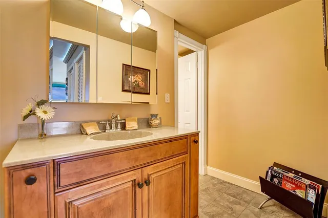a bathroom with a sink and a mirror