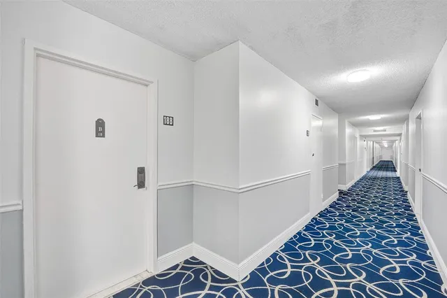 a view of a storage & utility room with two washing machine